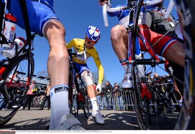 Nacer Bouhanni checks his knee after crashing yesterday