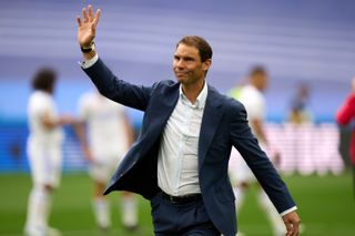 Rafael Nadal waves to fans at the Santiago Bernabeu ahead of Real Madrid's game against Espanyol in April 2022.