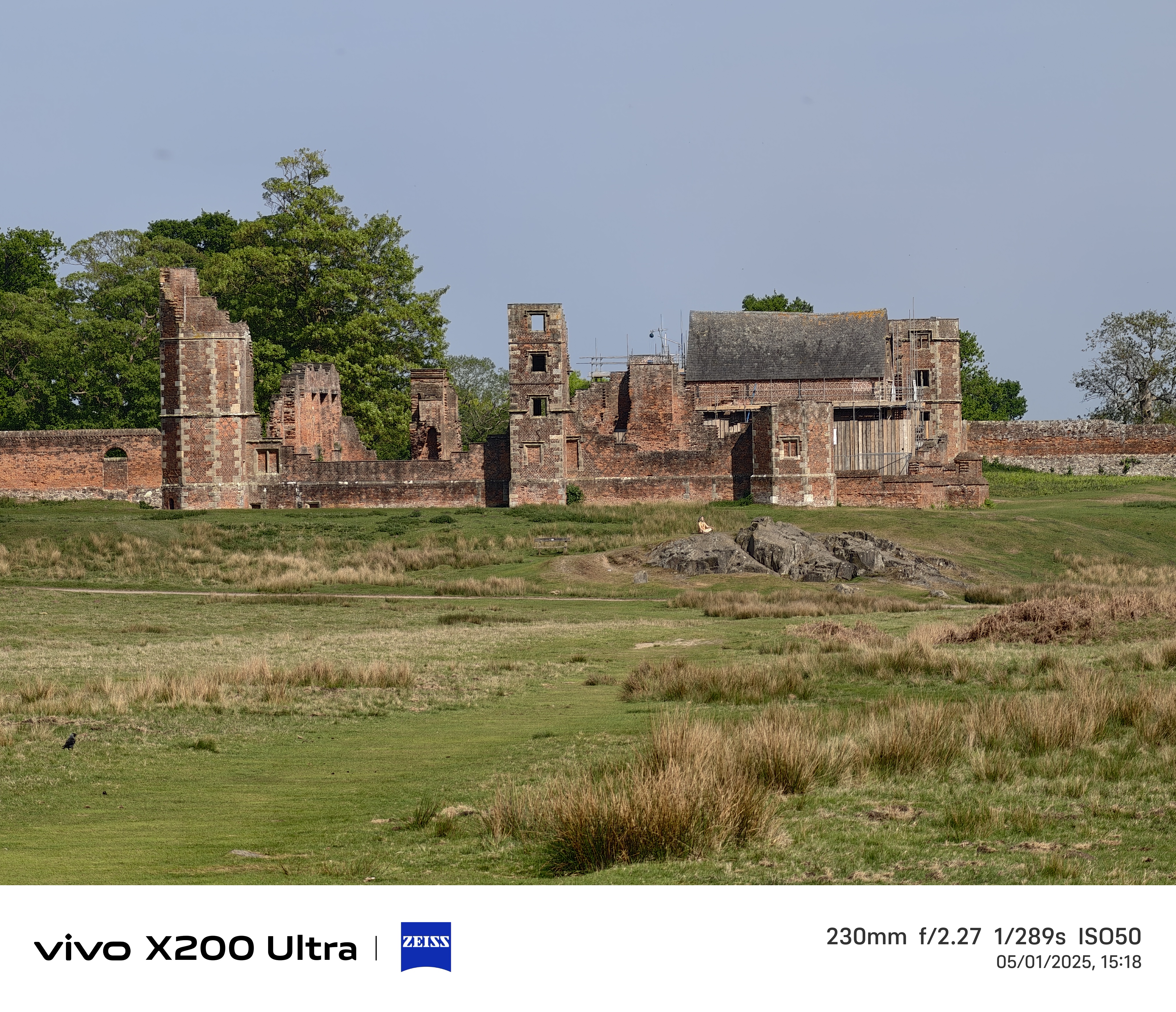 Old ruins in the distance across a field