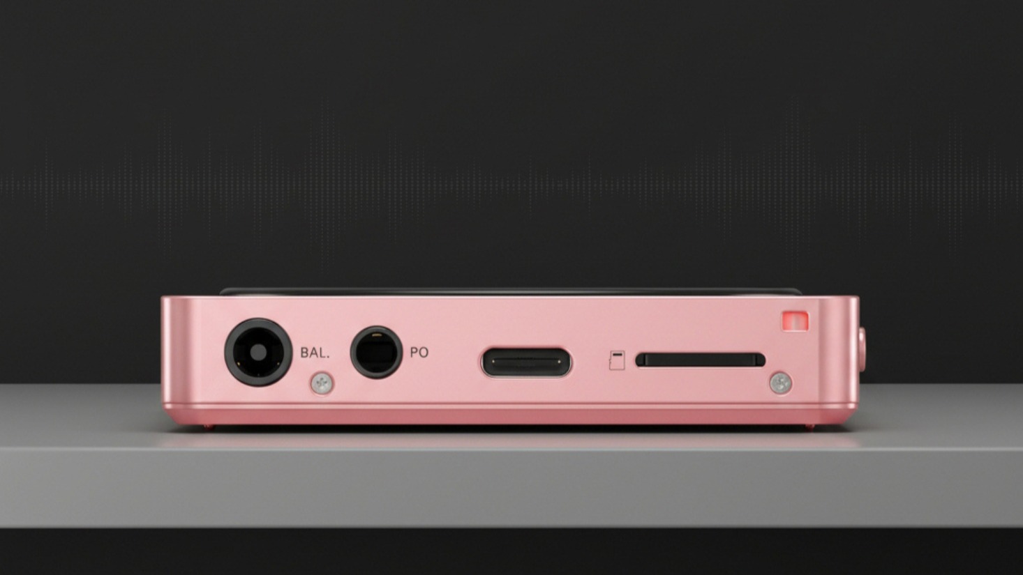 FiiO Snowsky Disc portable music player in pink on its side