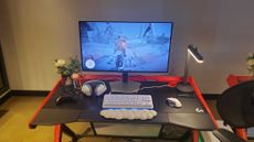 gaming monitor near white keyboard