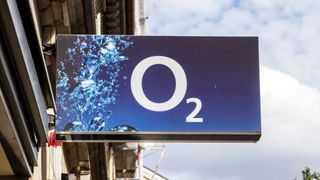 An O2 shop sign with an overcast sky in the background
