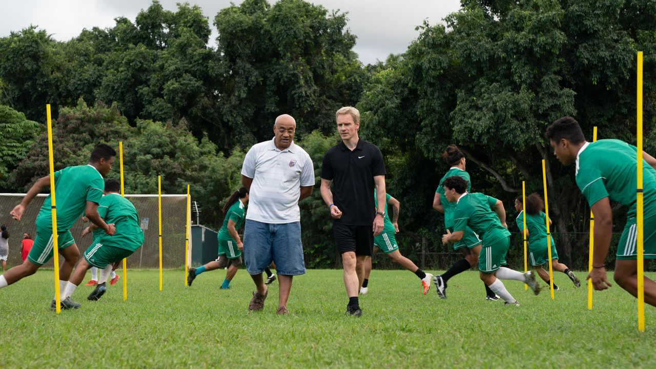 Oscar Knightley and Michael Fassbender in Next Goal Wins