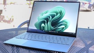A shot of the Microsoft Surface Laptop Go 3 being used outside on a table