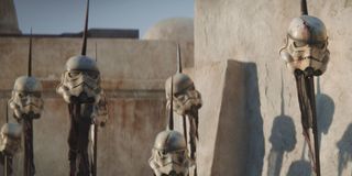 Stormtrooper helmets on spikes in The Mandalorian
