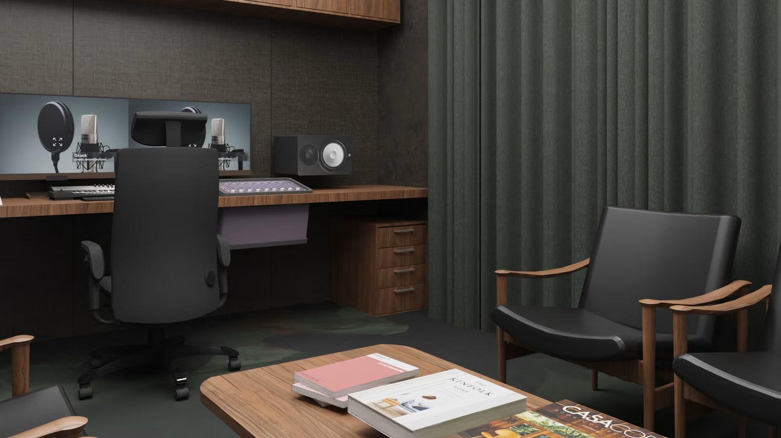 Modern soundproof studio with a desk, microphone, and monitor. Black chair faces sound equipment. Cozy seating area with books on a wooden table.
