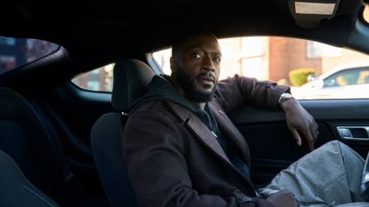 Aldis Hodge as Alex Cross, sitting in the front seat of a car, in &#039;Cross.&#039;