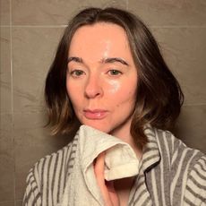 Grace Day using a cleanser and wash cloth on her skin