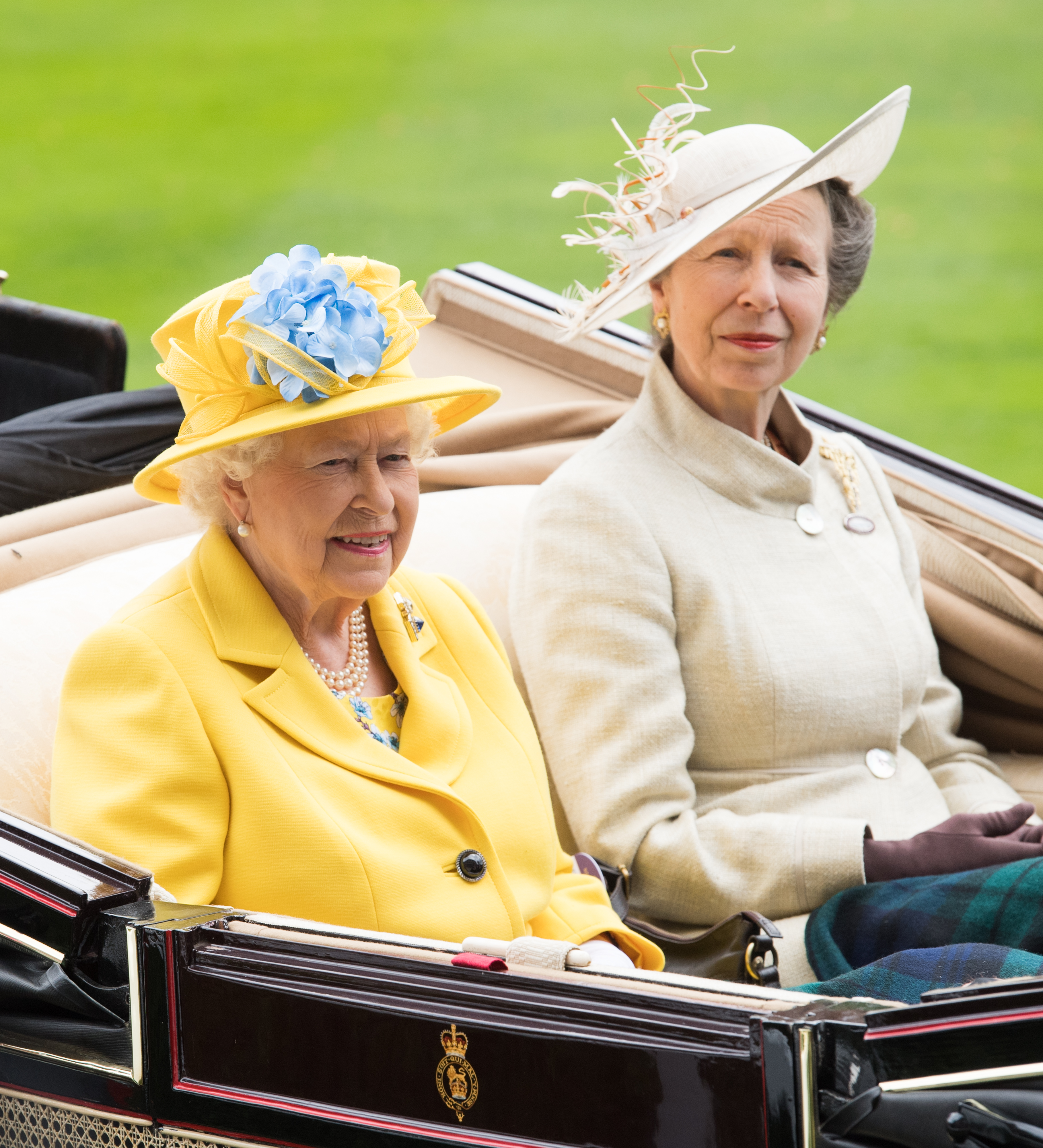 Queen Elizabeth and Princess Anne riding in a carriage at Royal Ascot 2018