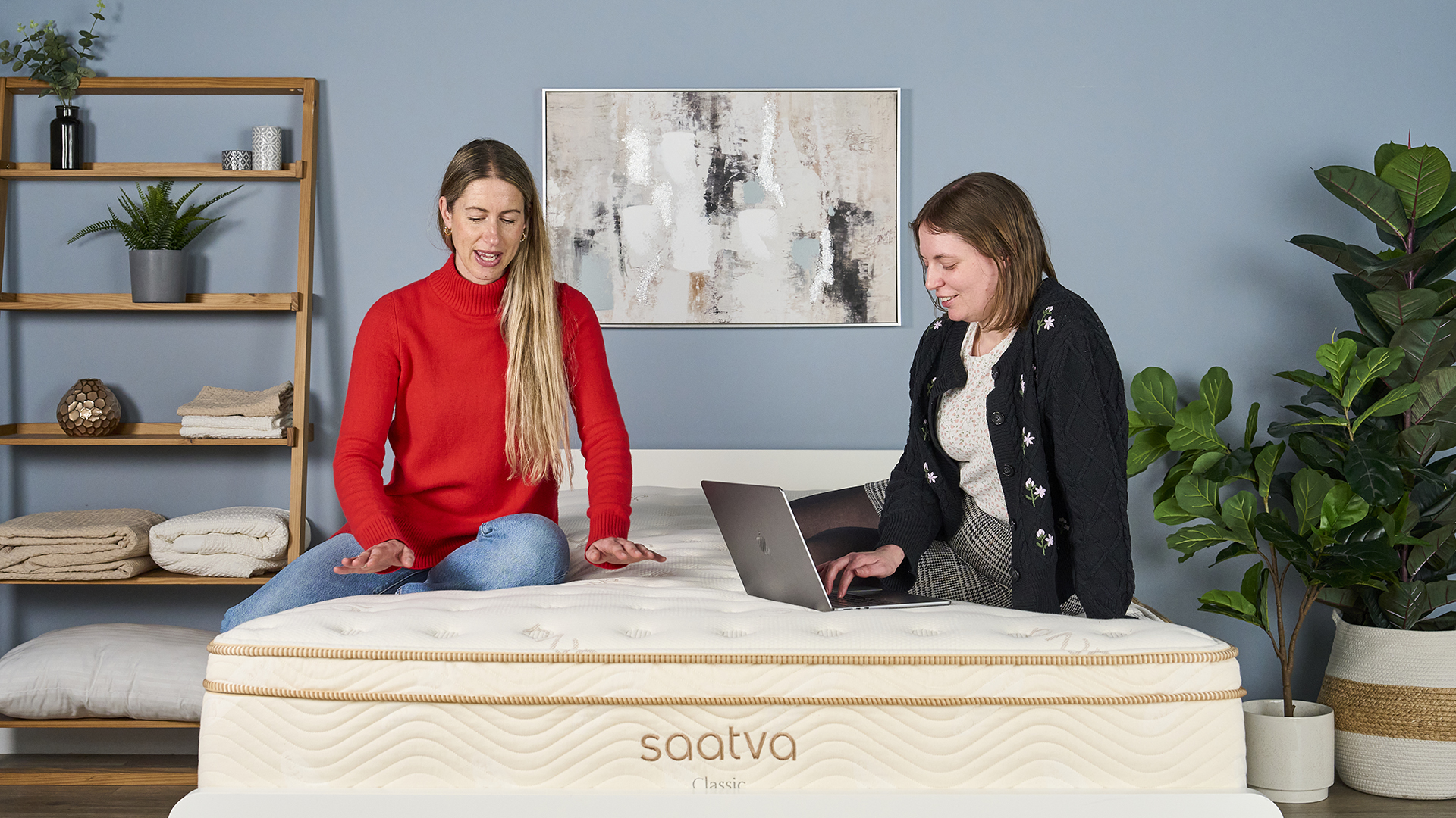 Tom's Guide's Sleep Editor and Senior Sleep Staff Writer sit on the Saatva Classic and discuss how it feels compared to other mattresses we have recently tested