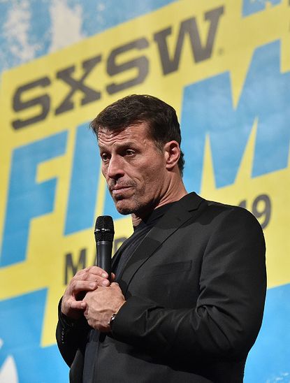 Motivational speaker Tony Robbins encouraged attendees to his latest event in Dallas to walk on hot coals. 