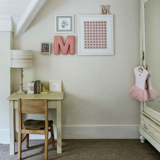 childs room with white wall and brown textured floor