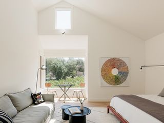 minimalist white interior with large window