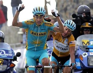 Andrey Kashechkin (Astana Team) wins Stage 18 atop Sierra de la Pandera, as team-mate Alexandre Vinokourov celebrates behind him.
