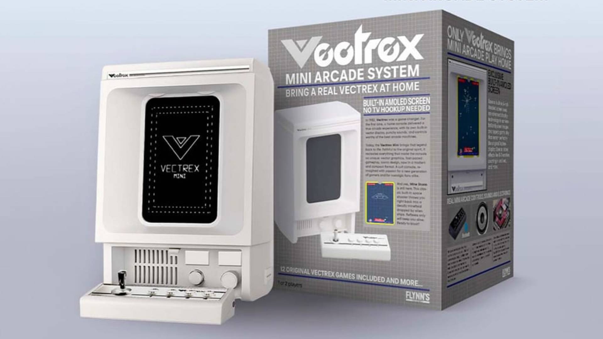 White Vectrex Mini console next to box with grey backdrop.