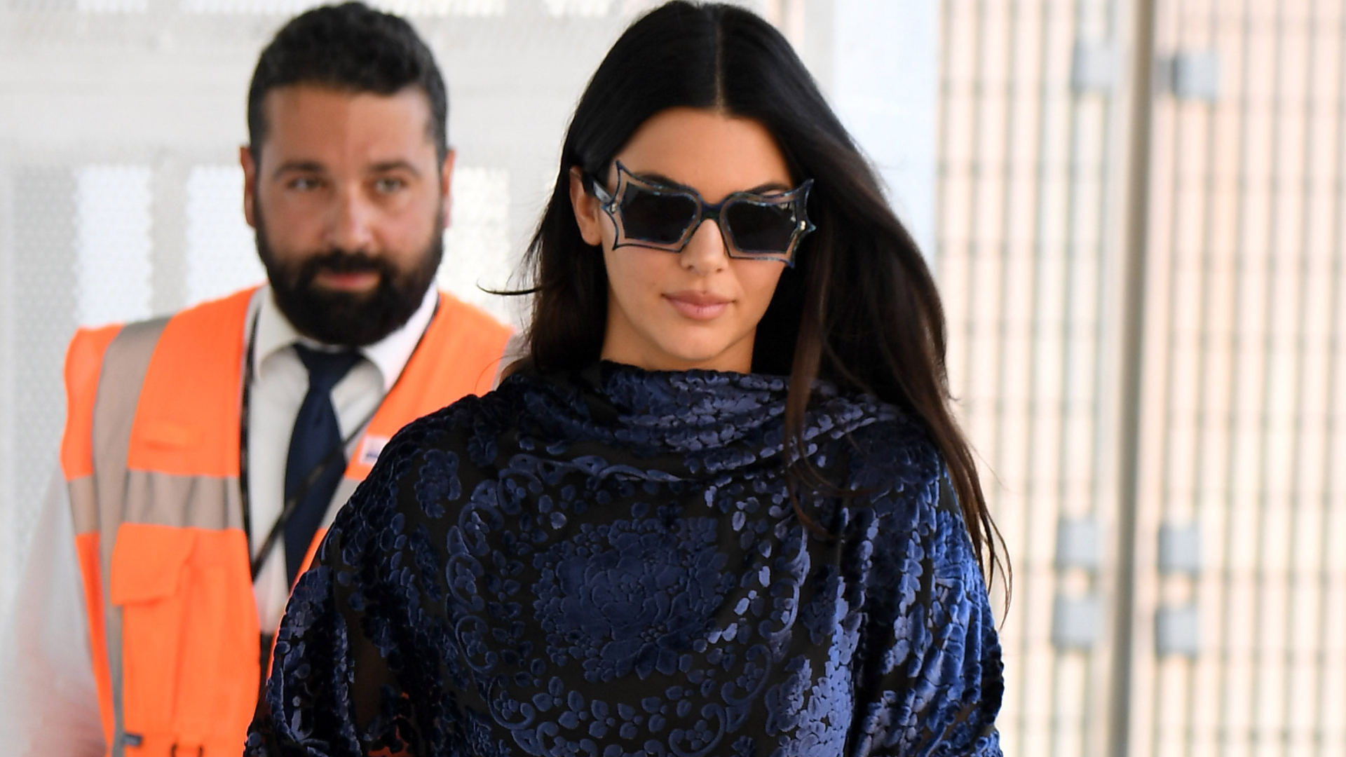 Kendall Jenner styled a poncho as a going-out top with the dark denim trend and ballet flats in Venice