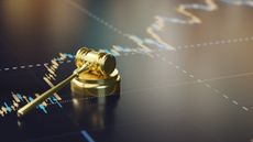 investment culture &ndash;&nbsp;gavel lying on a stock chart