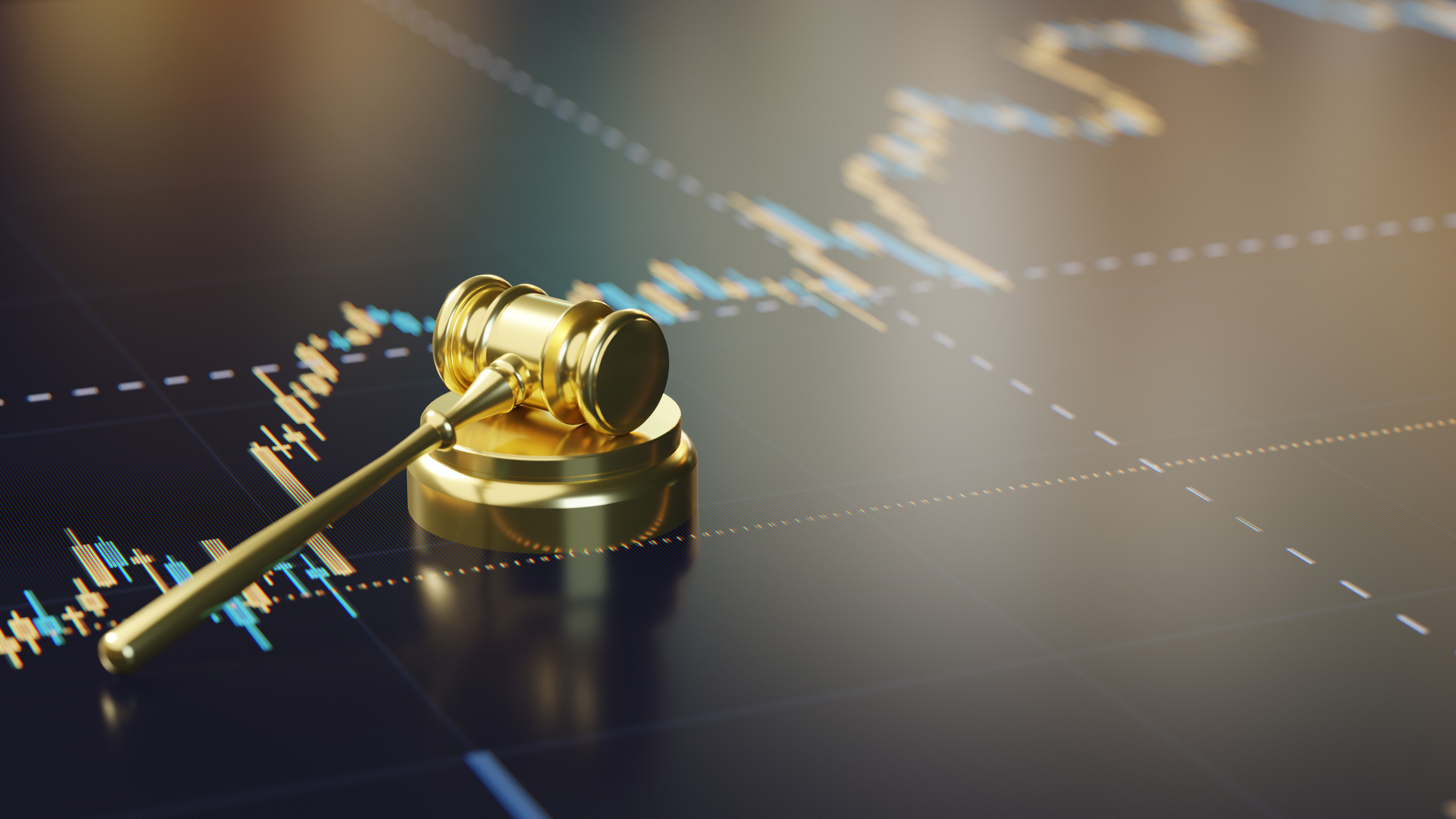 investment culture &ndash;&nbsp;gavel lying on a stock chart