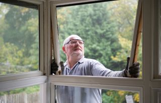 Man replacing a window