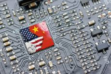 Flag of USA and China on a microchip on a motherboard.
