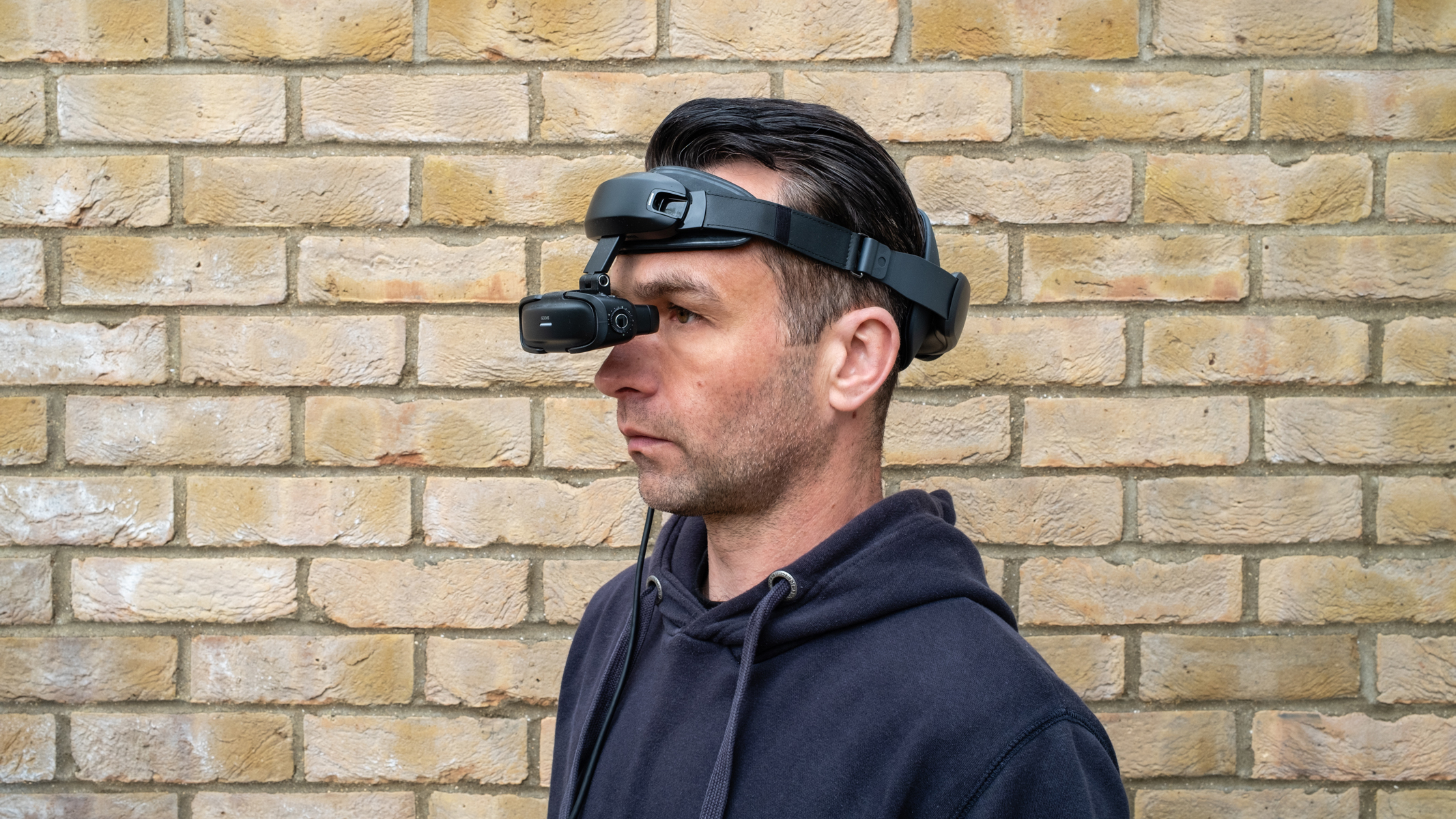 A man wearing a Goovis Art head-mounted display