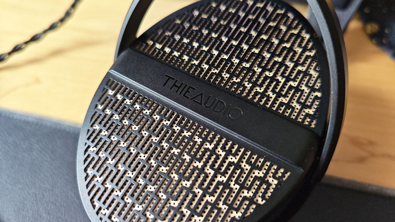 The Theiaudio Cypher headphone in a work office setting.