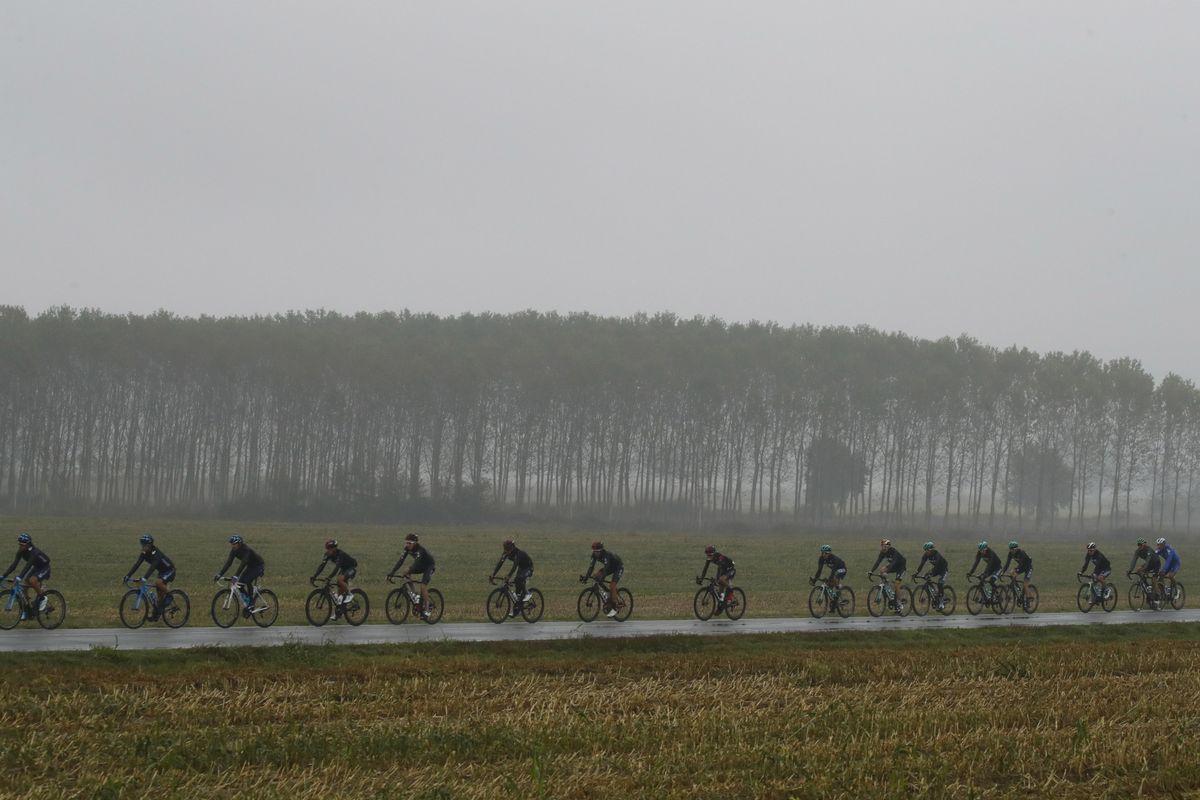 The peloton riding through miserable conditions at Milano-Torino