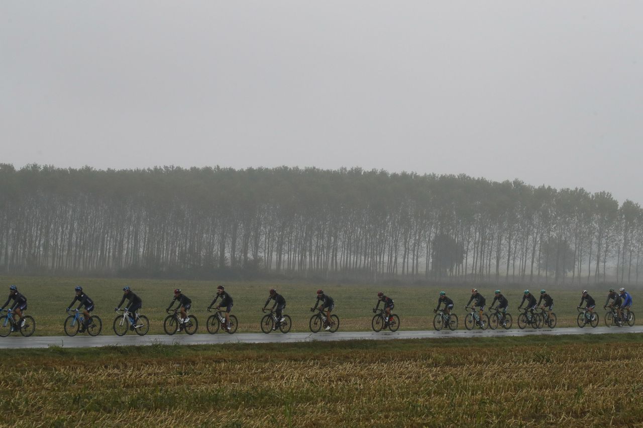 The peloton riding through miserable conditions at Milano-Torino