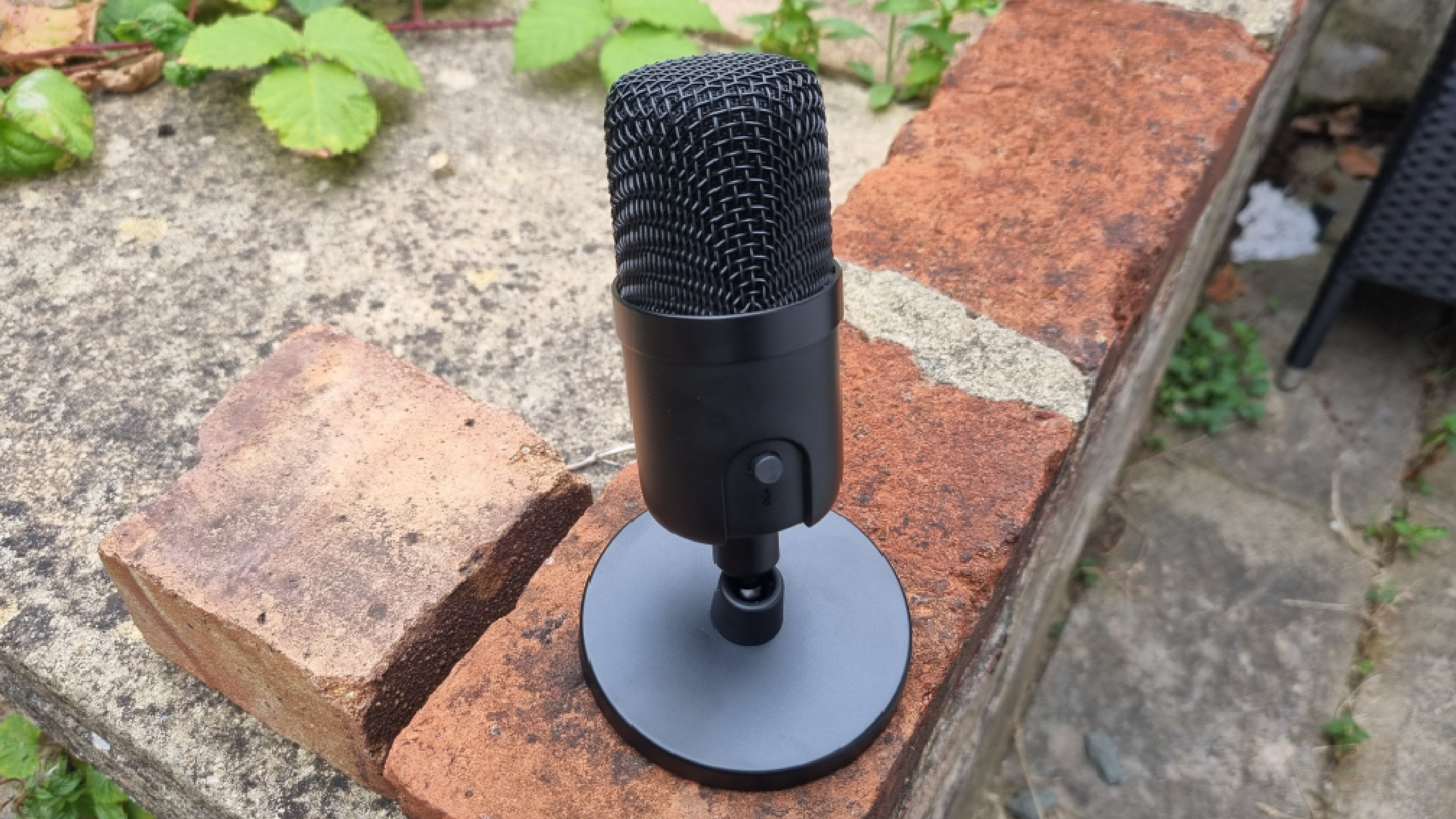 The Amazon Basics USB Condenser microphone on a wall