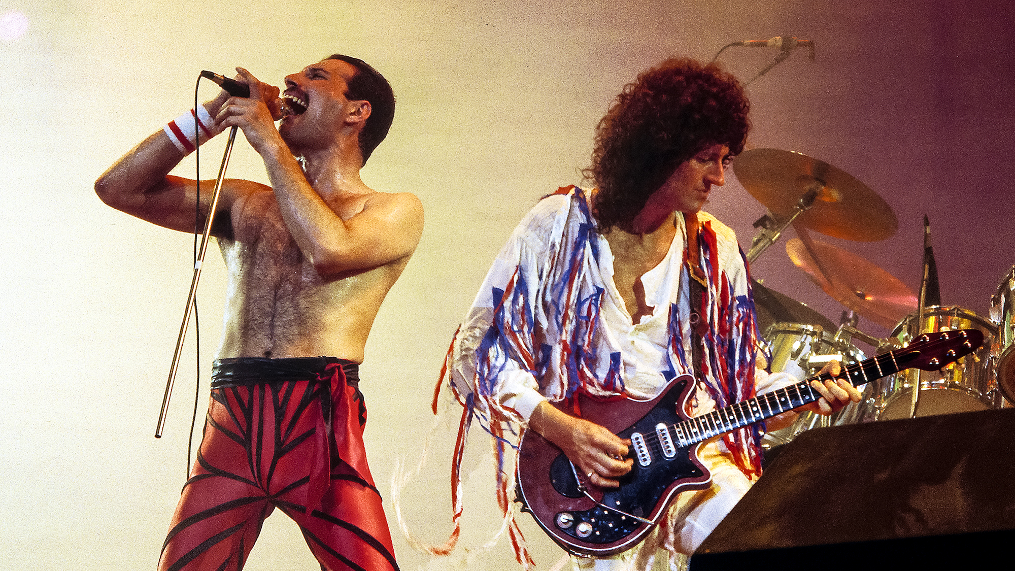 Brian MAY and Freddie MERCURY and QUEEN; Freddie Mercury and Brian May performing live on stage  