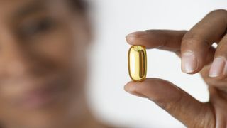 woman holding supplement menopause supplements