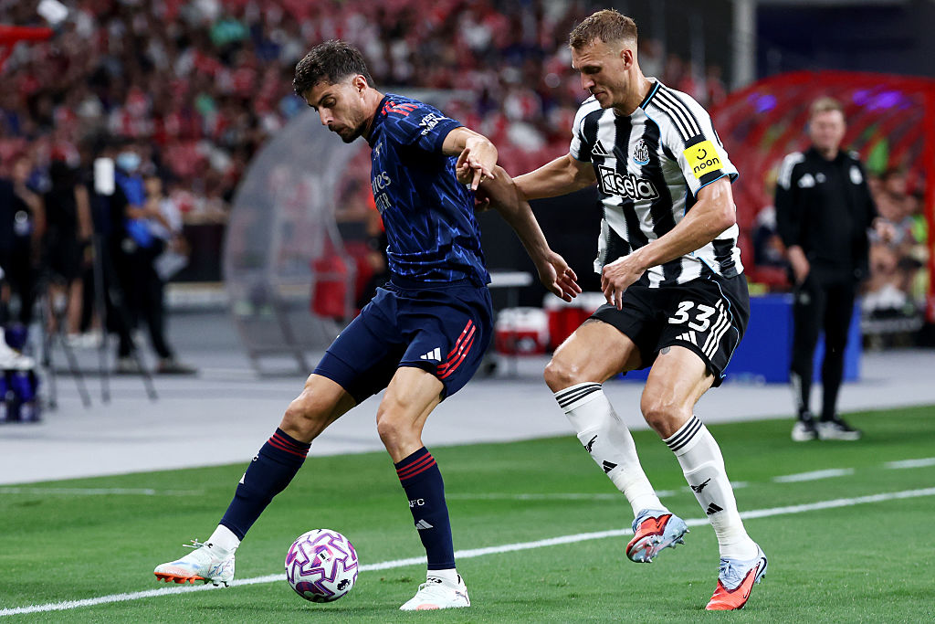 Kai Havertz of Arsenal controls the ball against Dan Burn of Newcastle United during the Pre-Season Friendly between Arsenal FC and Newcastle United at the National Stadium on July 27, 2025 in Singapore