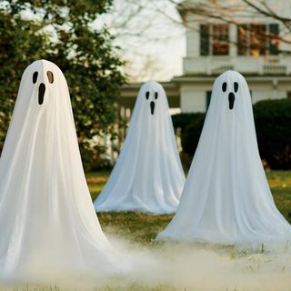 ghosts on a front lawn