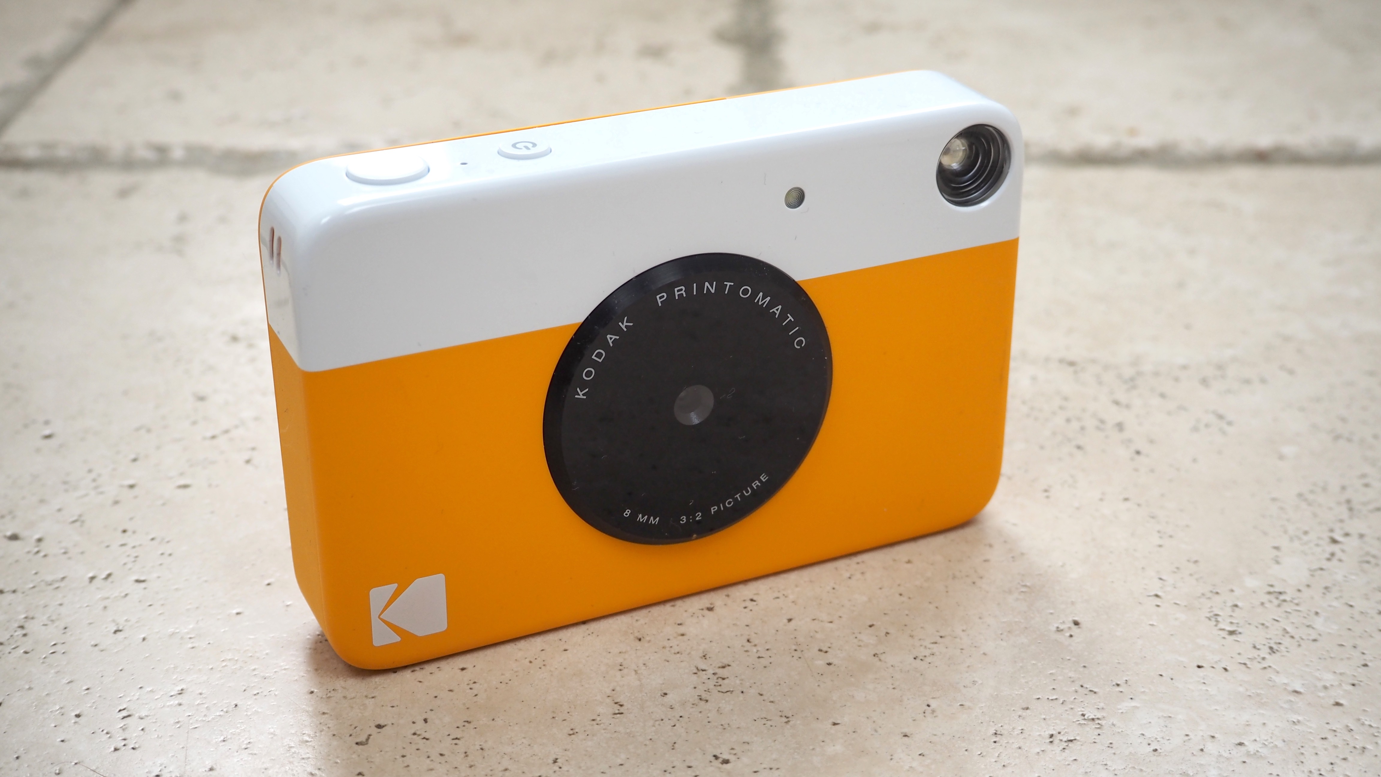 How long does it take to charge the Kodak Printomatic battery?