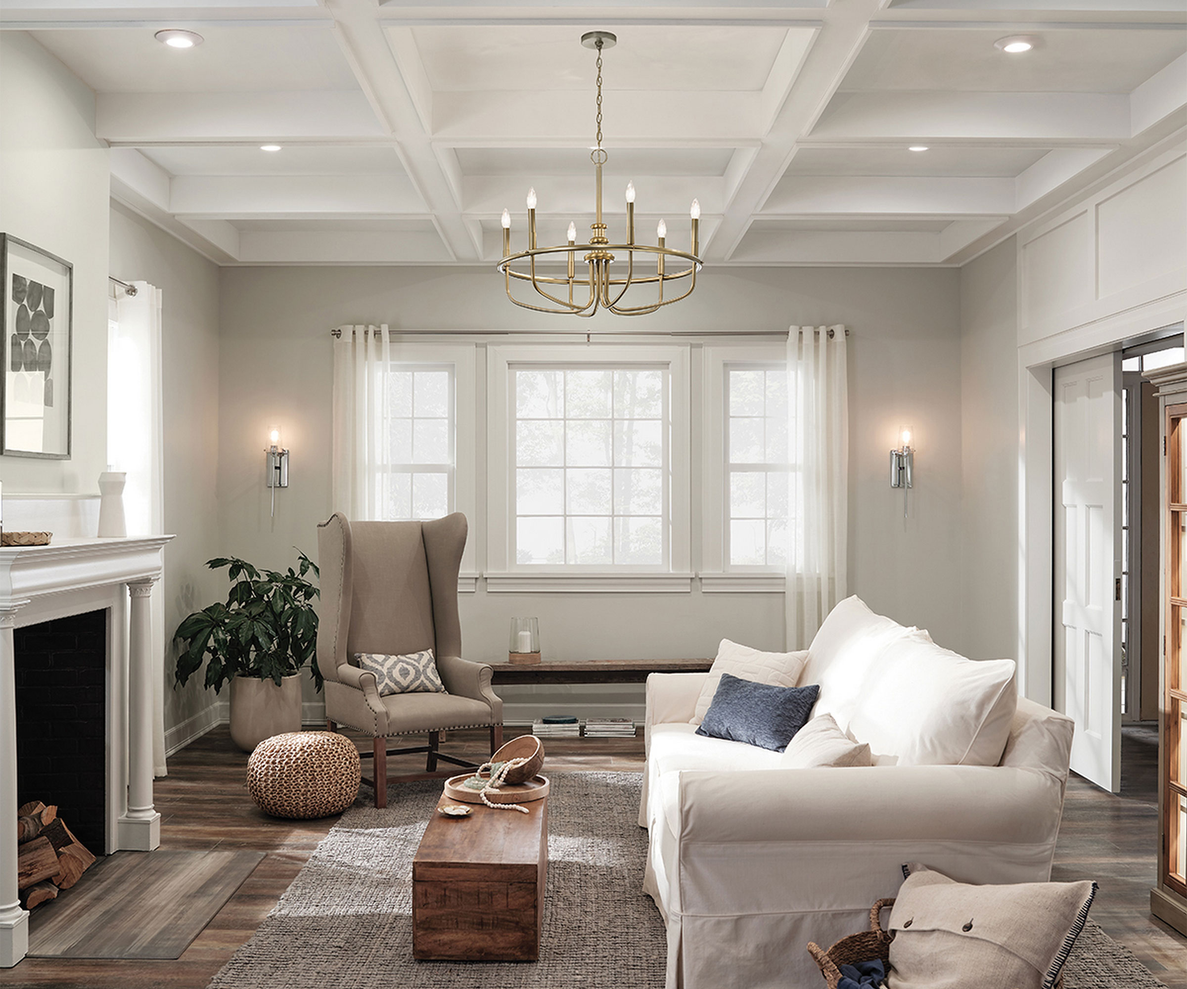 elegant white living room with white fireplace and layered lighting scheme