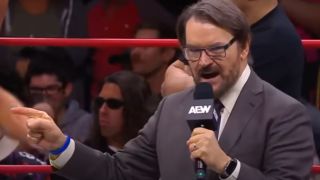 Tony Schiavone with a microphone in AEW