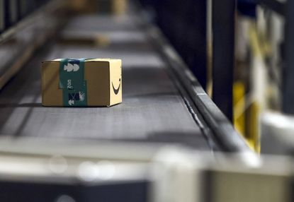  boxed item on a conveyor belt at an Amazon fulfilment center