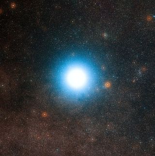 This wide-field view of the sky around the bright star Alpha Centauri was created from photographic images forming part of the Digitized Sky Survey 2. The star appears so big just because of the scattering of light by the telescope's optics as well as in the photographic emulsion. Alpha Centauri is the closest star system to the Solar System. Image released Oct. 17, 2012.