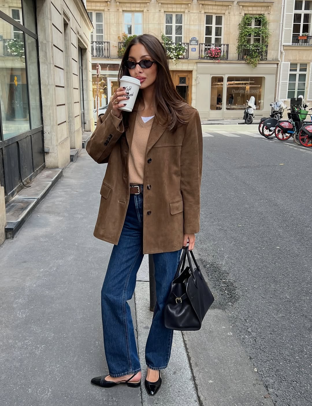 Influencer Felicia Akerstrom wearing straight leg jeans and slingback flats.