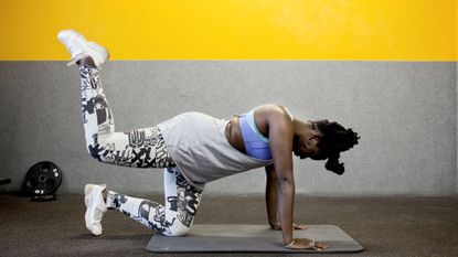 Woman working out on a mat