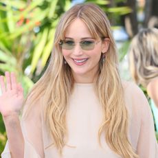 Jennifer Lawrence waves at the camera