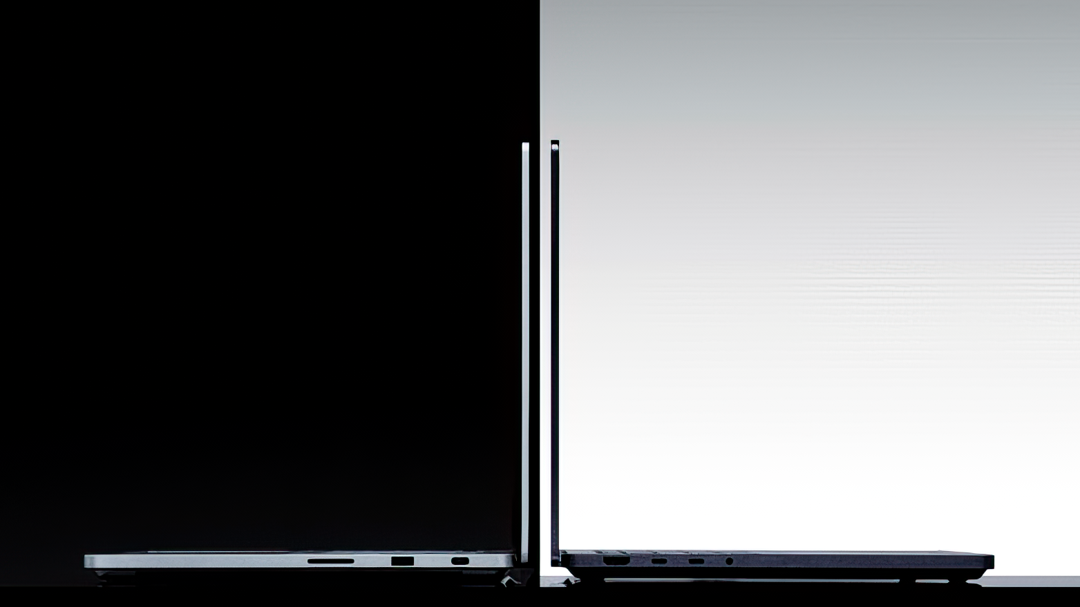 Side view of two Surface Laptop Ultras facing opposite directions on a split black-and-white background, symbolizing contrast and modernity.