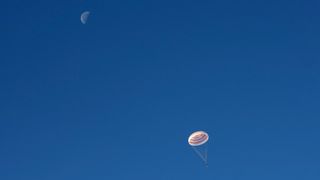 A Soyuz crew capsule carrying three crewmembers home from the International Space Station parachuted down to Earth under the first-quarter moon on Monday night (June 24). NASA astronaut Anne McClain, Russian cosmonaut Oleg Kononenko and Canadian Space Agency astronaut David Saint-Jacques touched down southeast of the town of Dzhezkazgan on the steppe of Kazakhstan at 10:47 p.m. EDT (0247 GMT or 8:47 a.m. local time on June 25).