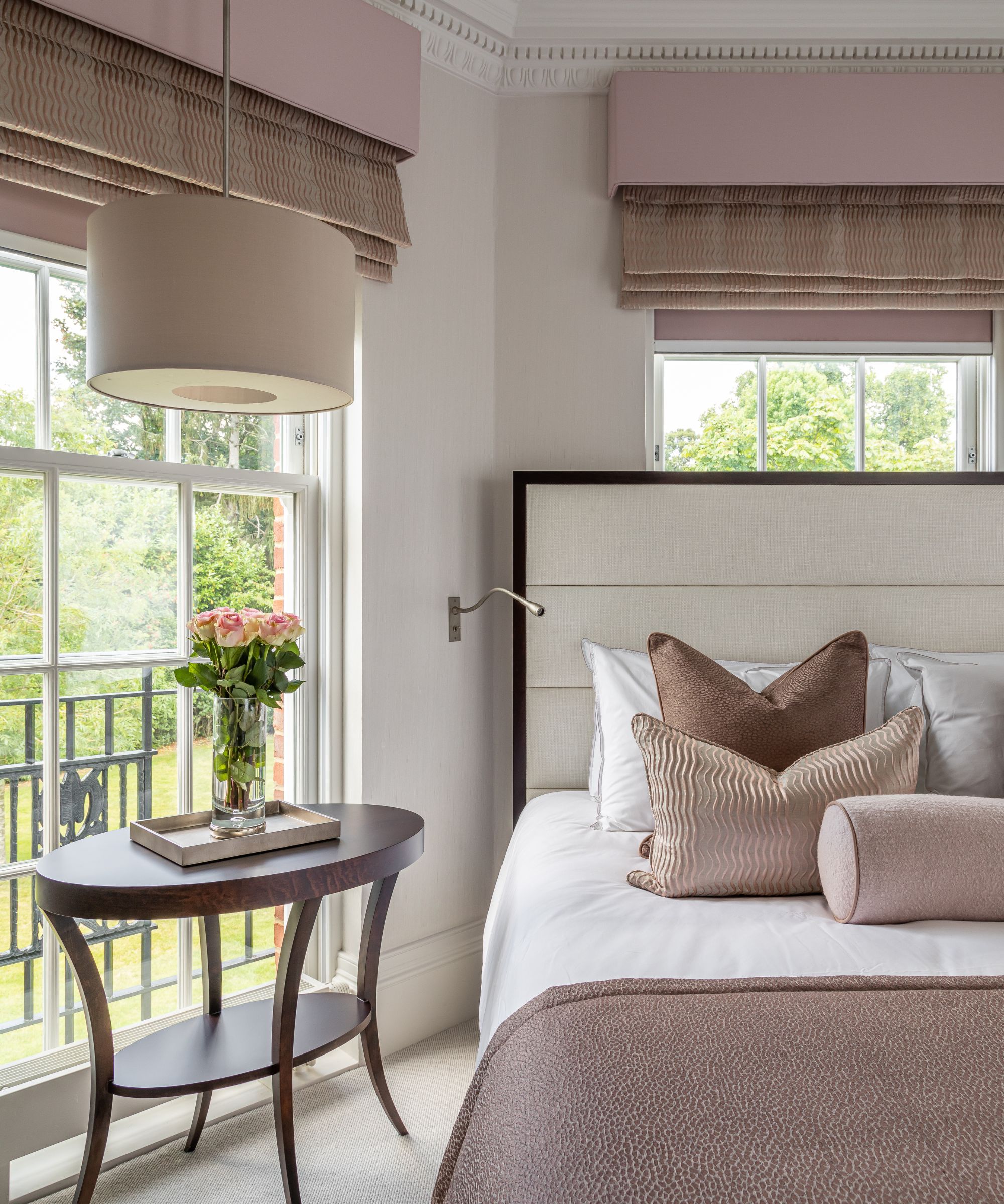 Pink drapes, cushions, wooden table