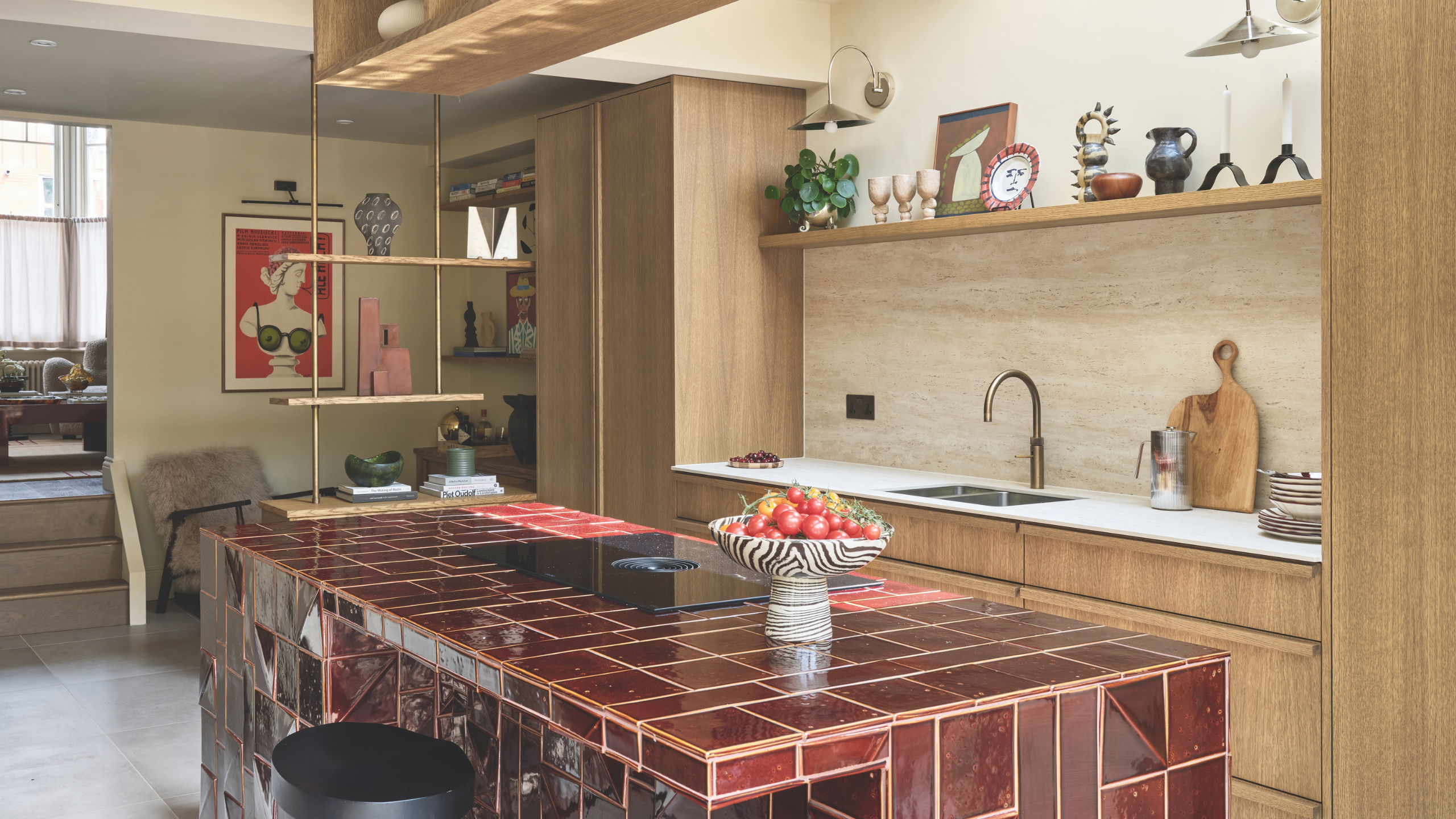 a kitchen with wood cabinets and a red tiled island