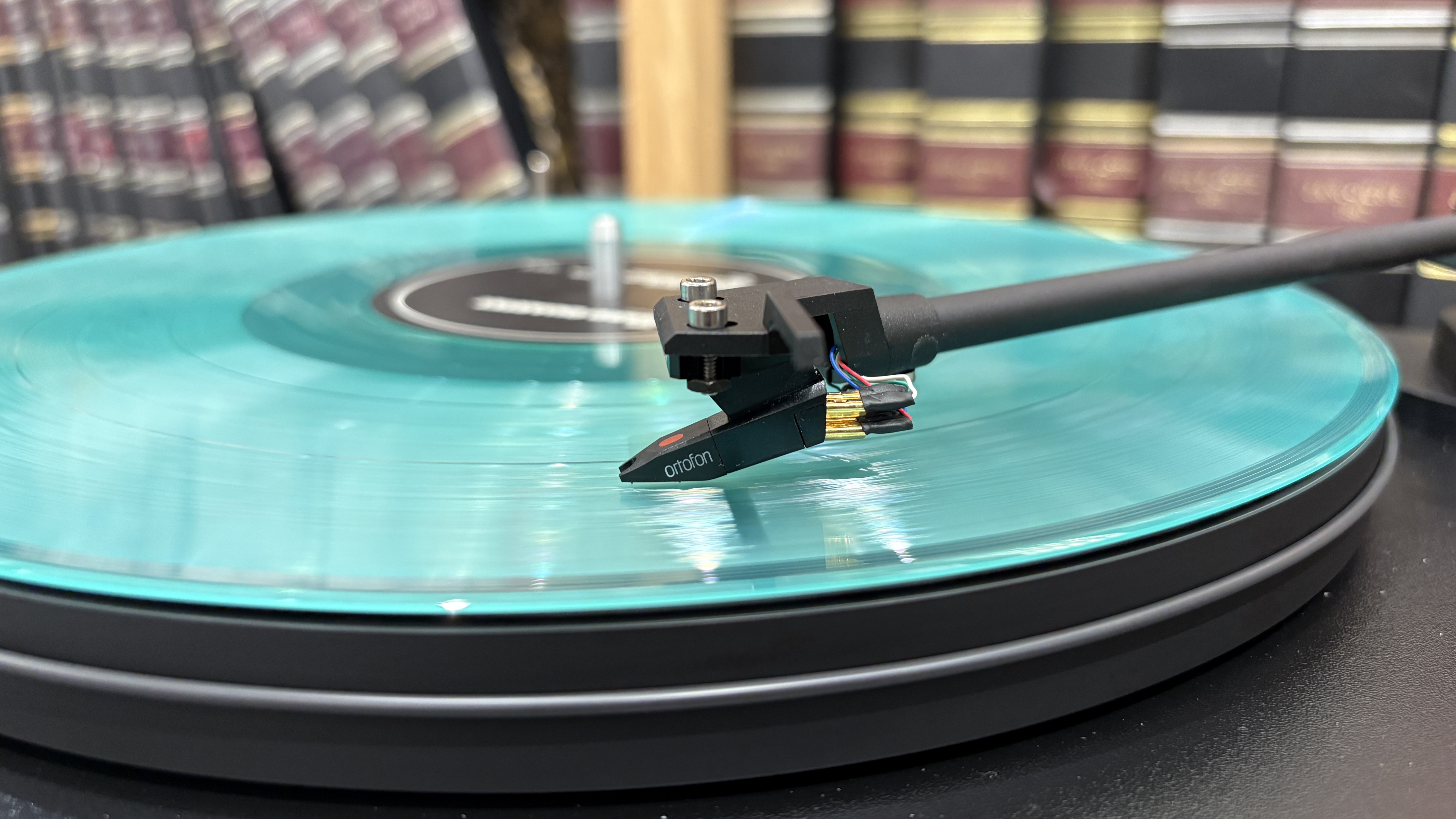 Pro-Ject Primary E turntable on wooden rack