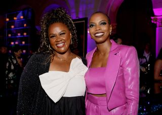 nicole byer and sasheer zamata pose together smiling at an event promoting their podcast best friends