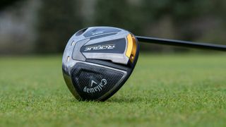 Callaway Rogue ST Max driver showing off its cool black and gold colorway on the golf course outdoors