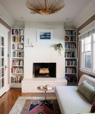 library living room with white sofa and alcove bookshelves