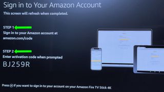 the fire tv setup screen asking to open an amazon page and enter a code